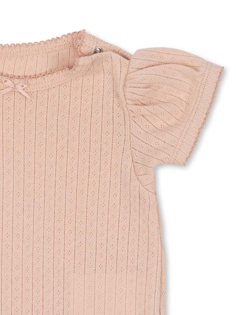 Bodystocking med korte ærmer og hulmønster fra danske Konges Sløjd.
