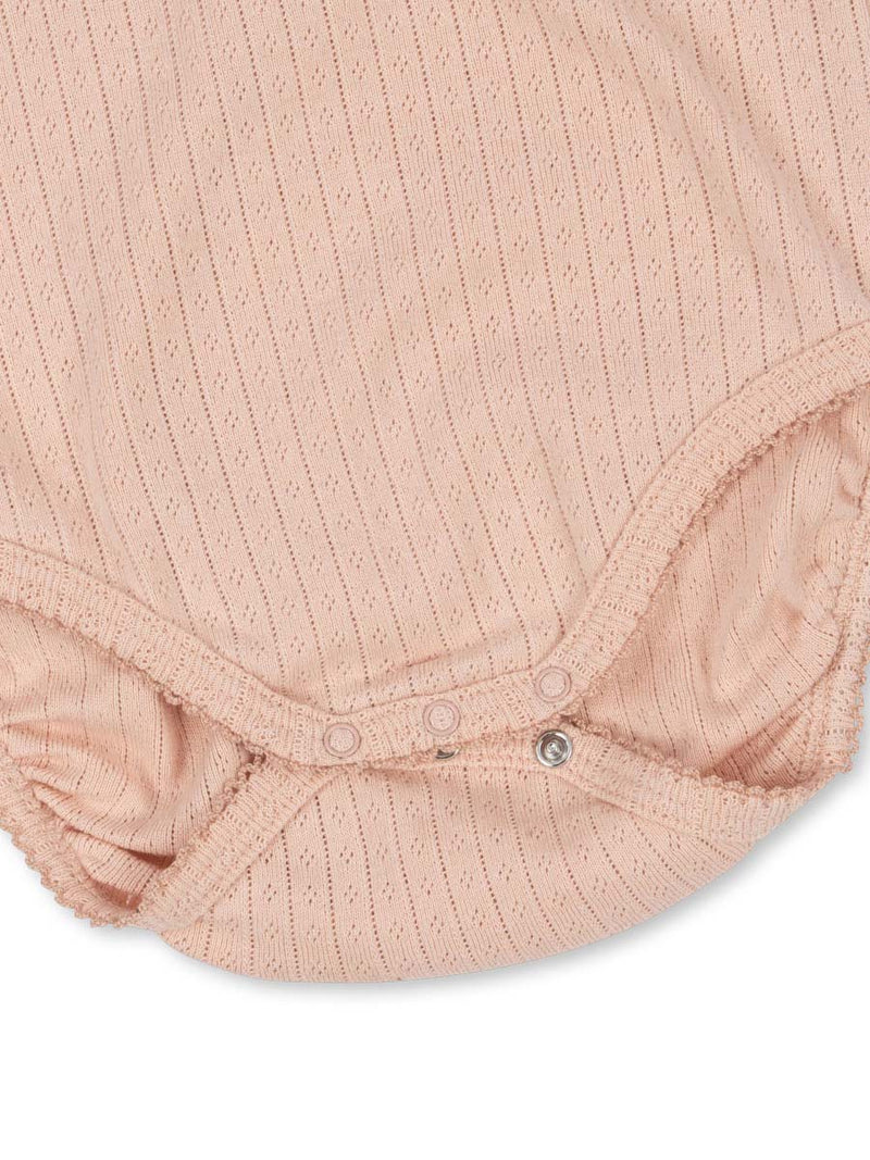 Bodystocking med korte ærmer og hulmønster fra danske Konges Sløjd